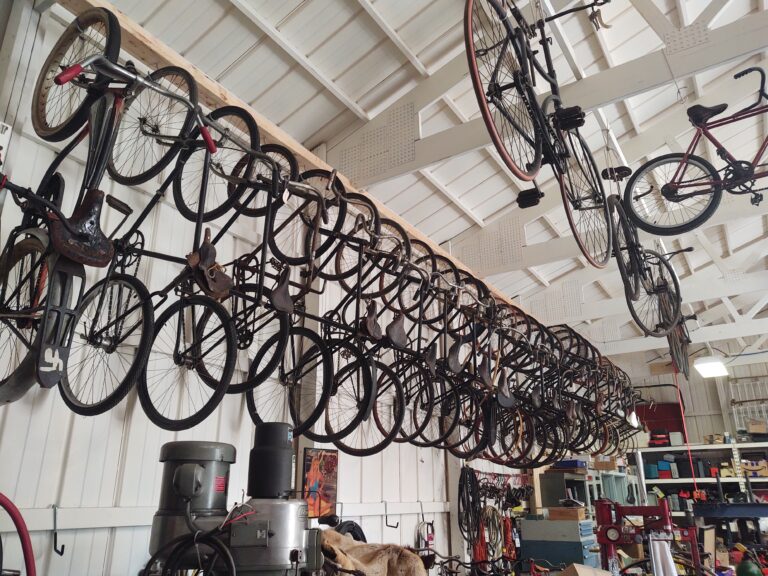 Collection of vintage bicycles hanging from the rafters
