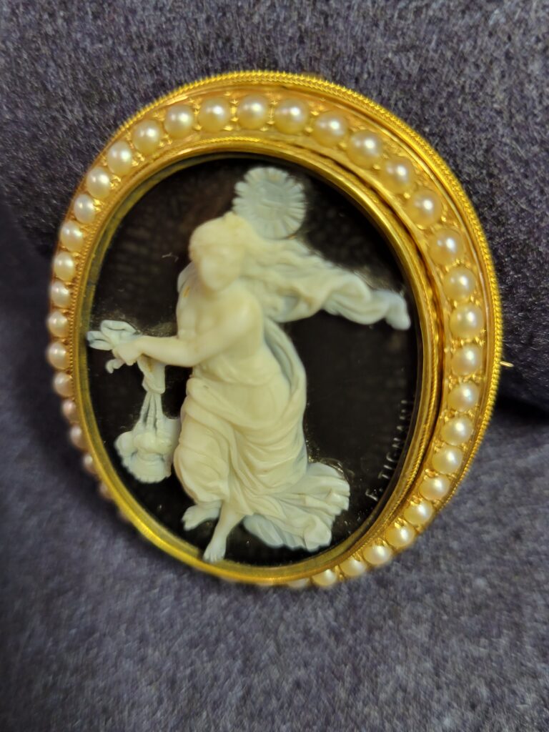 Antique carved cameo brooch framed in seed pearls