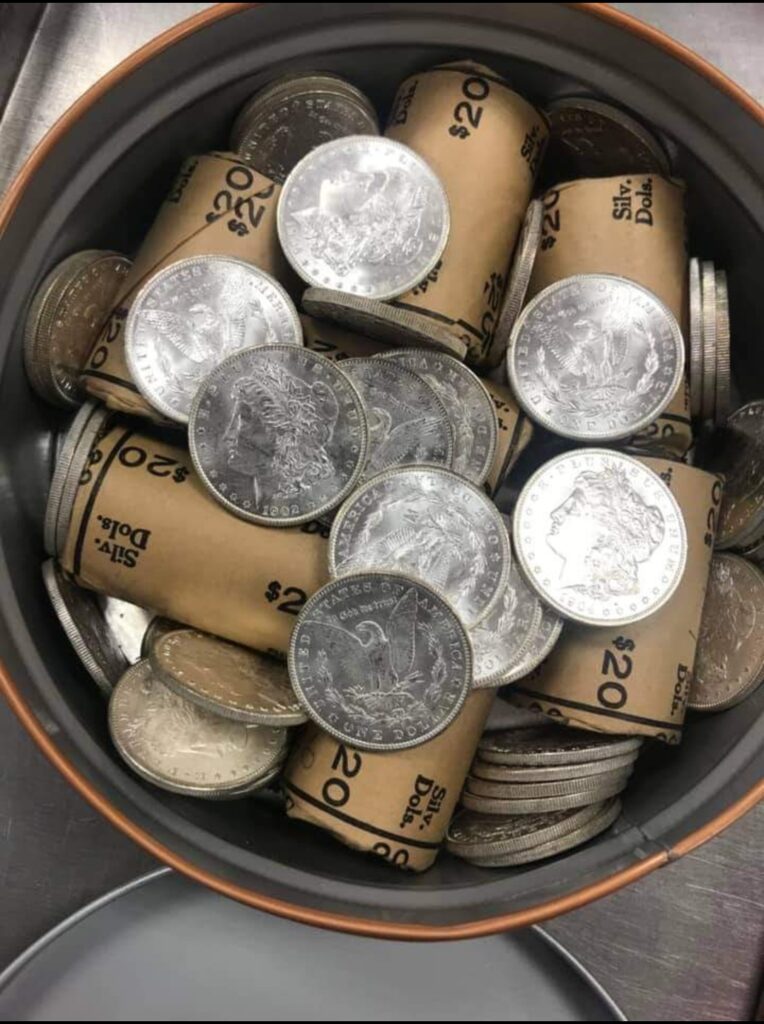 Bucket of silver coin rolls